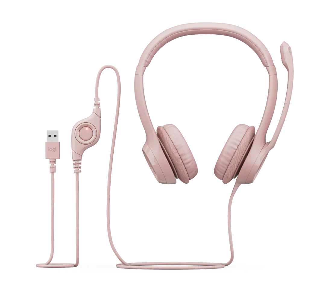 Pink wired headset with USB connector and adjustable microphone on white background