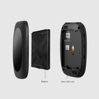 Disassembled black handheld device showing battery and nano SIM card slot on gray background