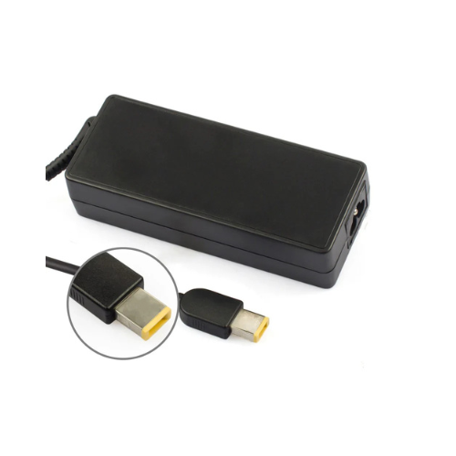 Black rectangular laptop power adapter with yellow-tipped rectangular plug connector