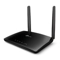Black TP-Link wireless router with two external antennas and status LEDs